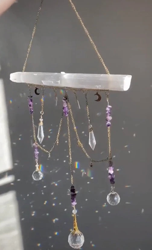 Selenite bar with a variety of crystals and K9