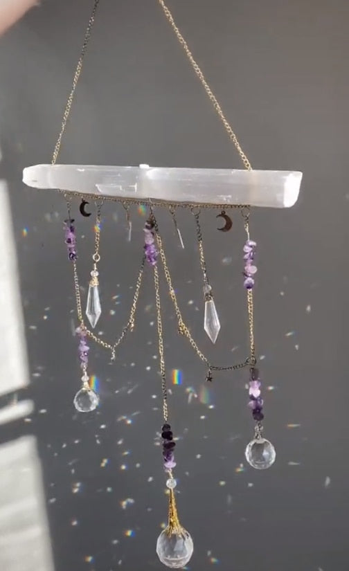Selenite bar with a variety of crystals and K9